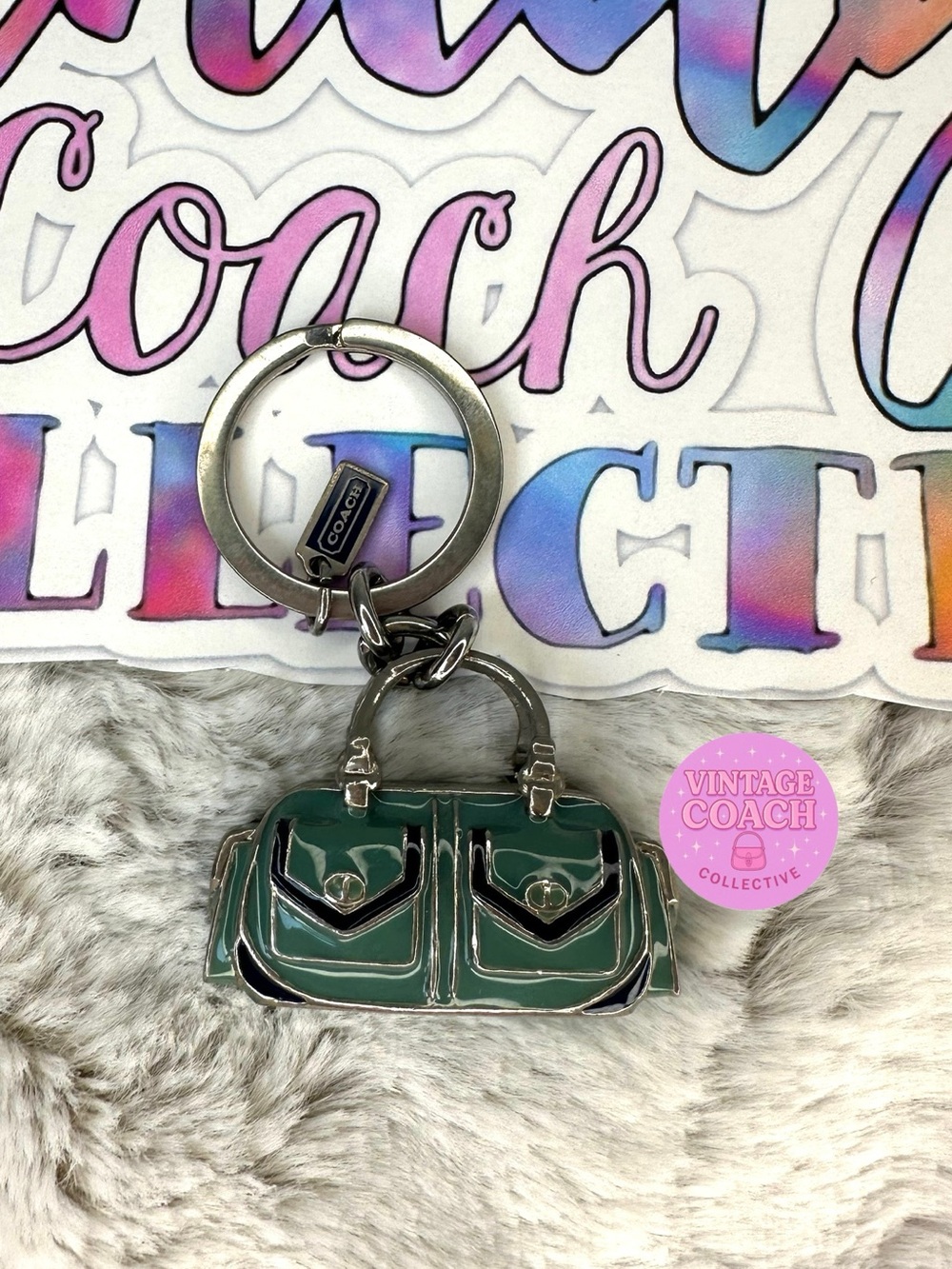 95$ Coach purse charm featuring silver
